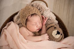 When can a baby sleep with a blanket?